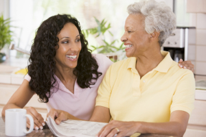 caregiver talking to elderly woman