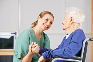 caregiver talking to senior woman